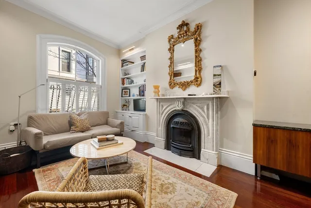 a kitchen with stainless steel appliances granite countertop a stove and a wooden floors