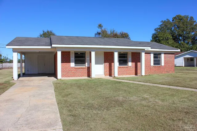 front view of a house with a yard