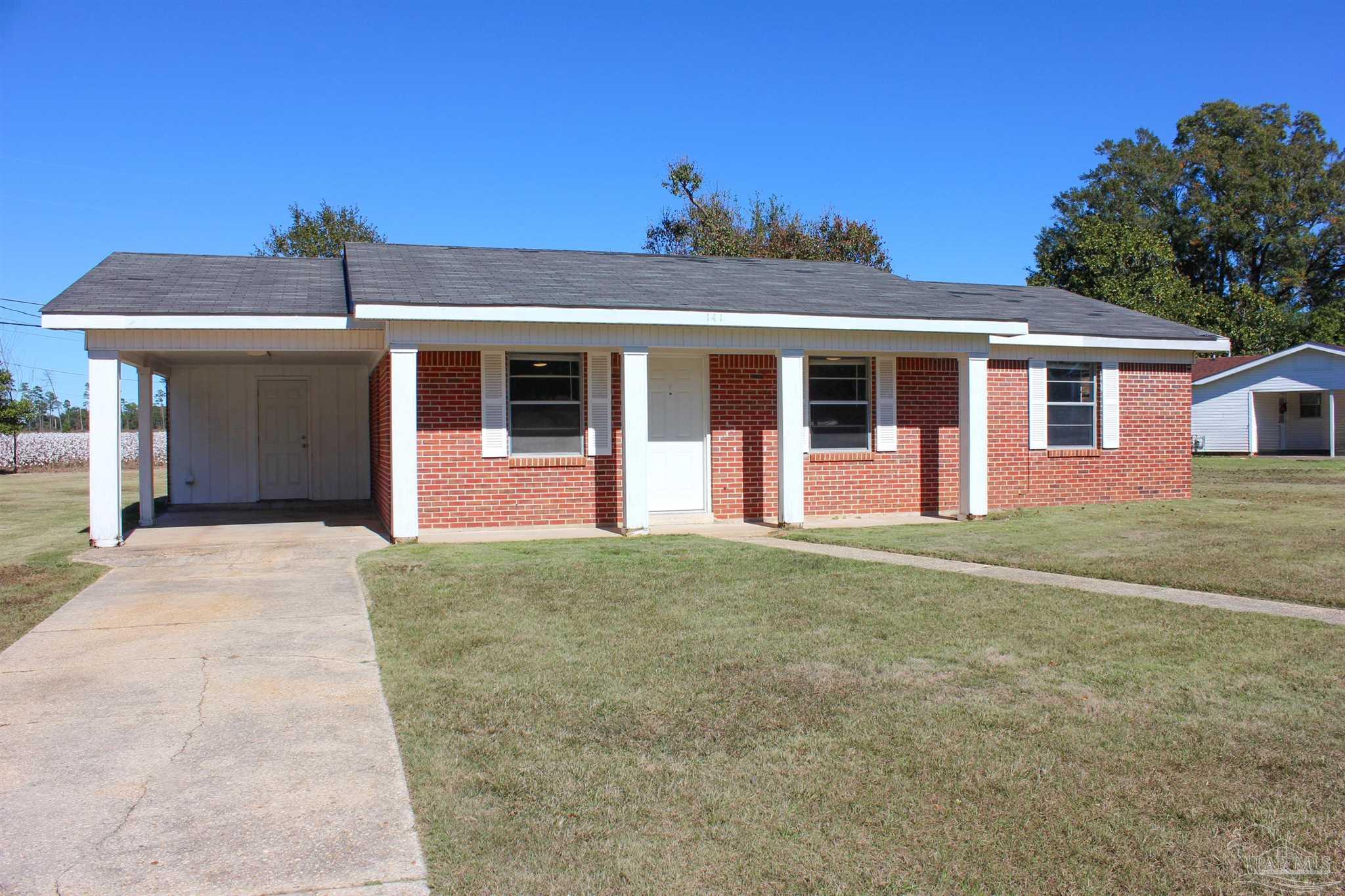 141 Holt Street Flomaton, AL 36441 - Photo 1 of 28 front view of a house with a yard