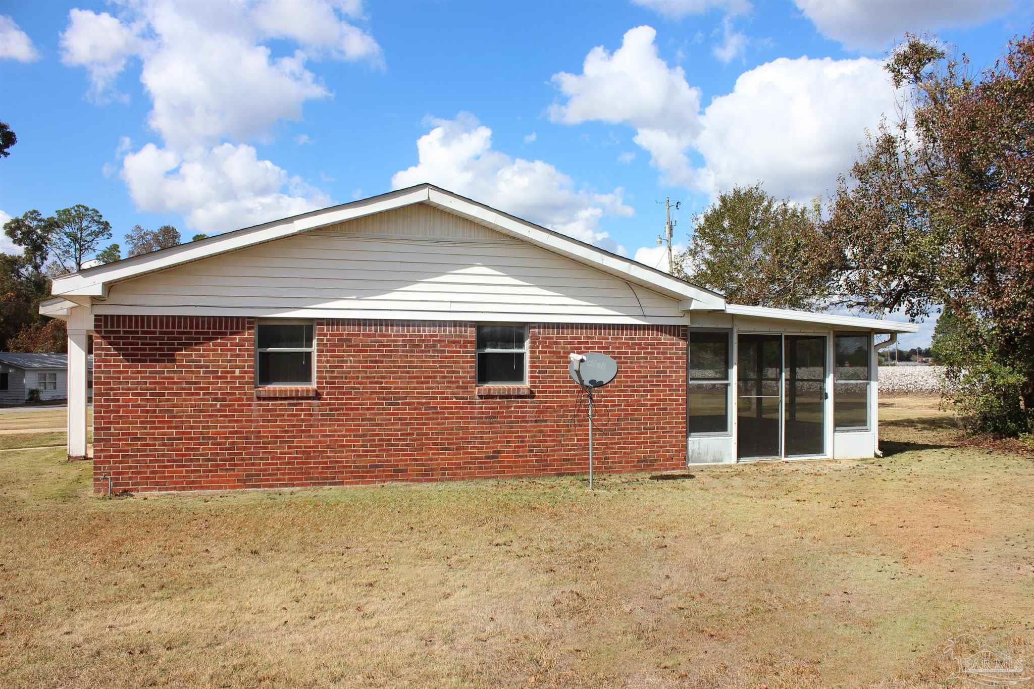 141 Holt Street Flomaton, AL 36441 - Photo 11 of 28 a front view of a house with yard