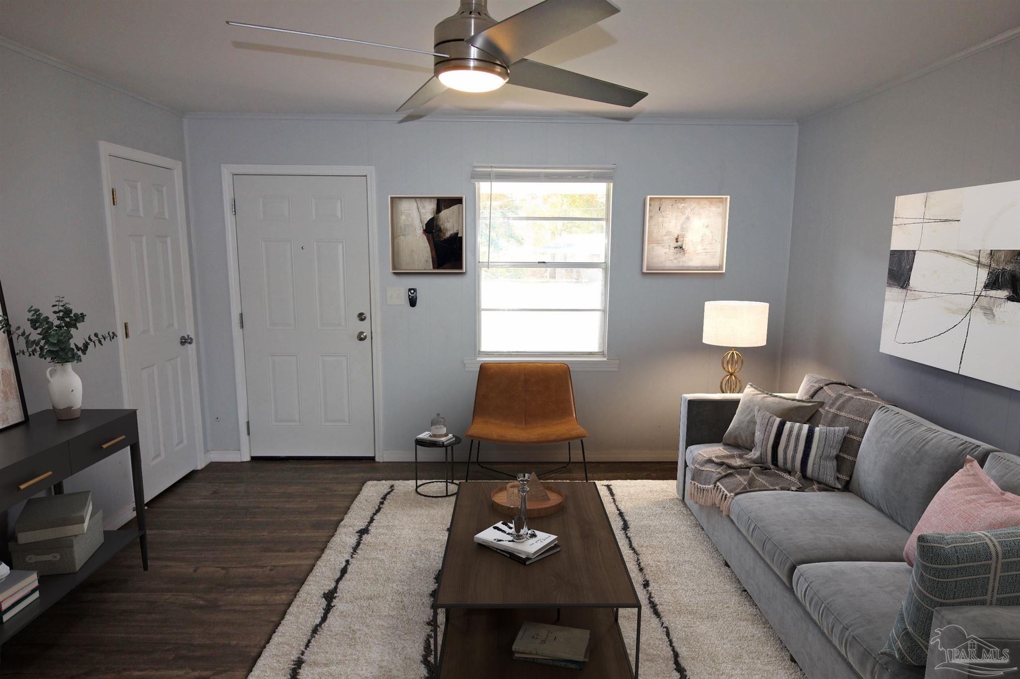 141 Holt Street Flomaton, AL 36441 - Photo 13 of 28 a living room with furniture and wooden floor