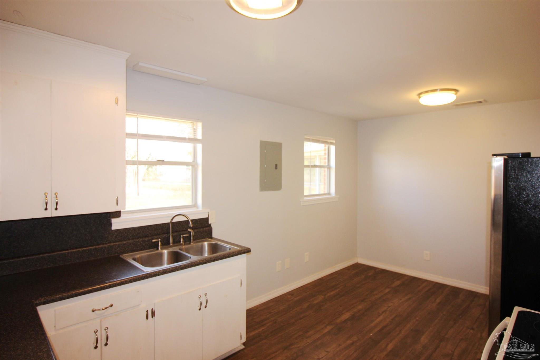141 Holt Street Flomaton, AL 36441 - Photo 19 of 28 a kitchen with a sink and a window