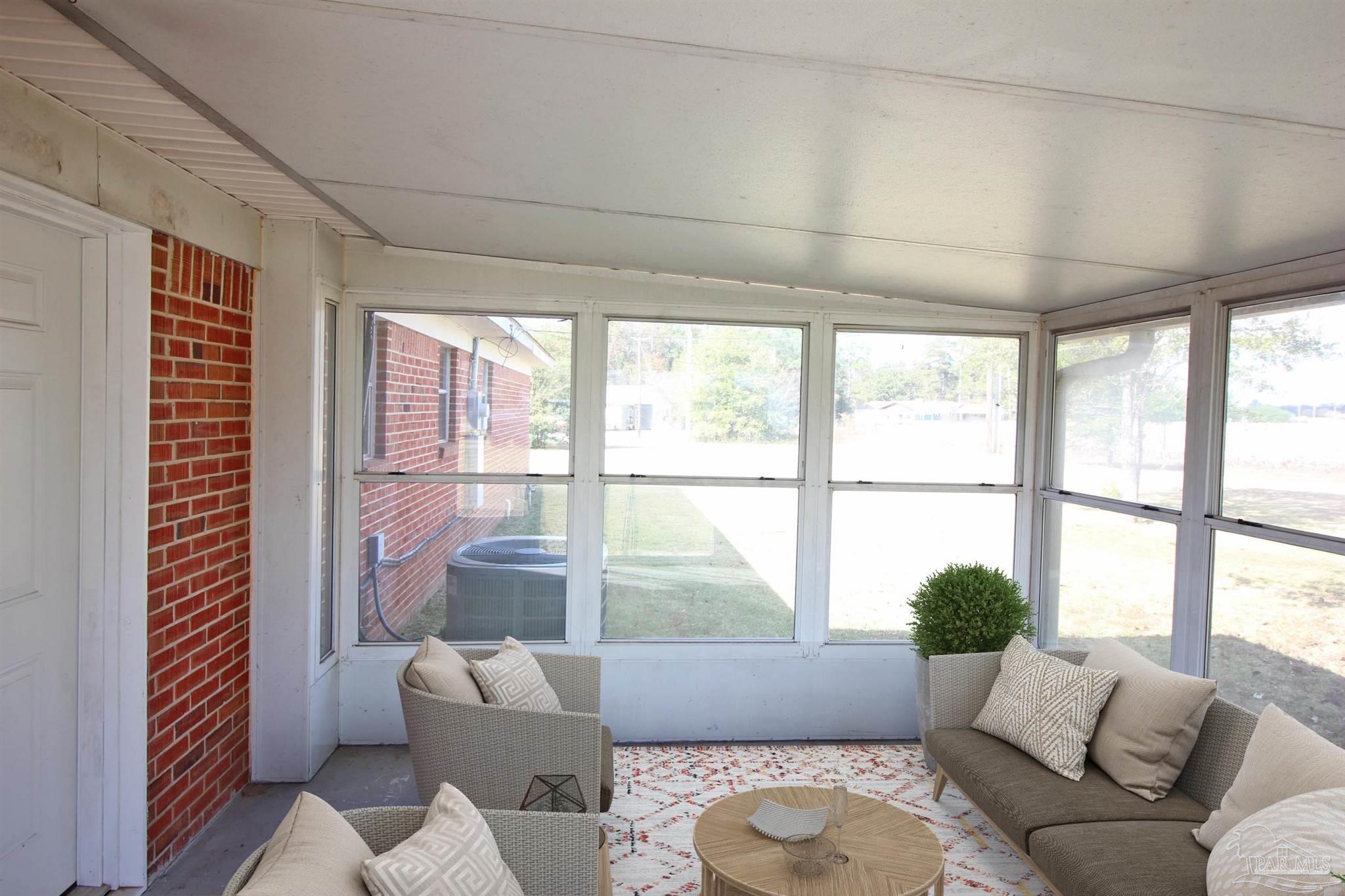 141 Holt Street Flomaton, AL 36441 - Photo 26 of 28 a living room with furniture and a large window