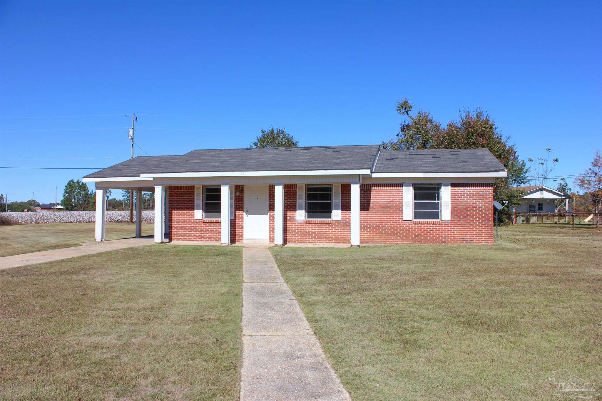 141 Holt Street Flomaton, AL 36441 - Photo 4 of 28 a front view of a house with yard