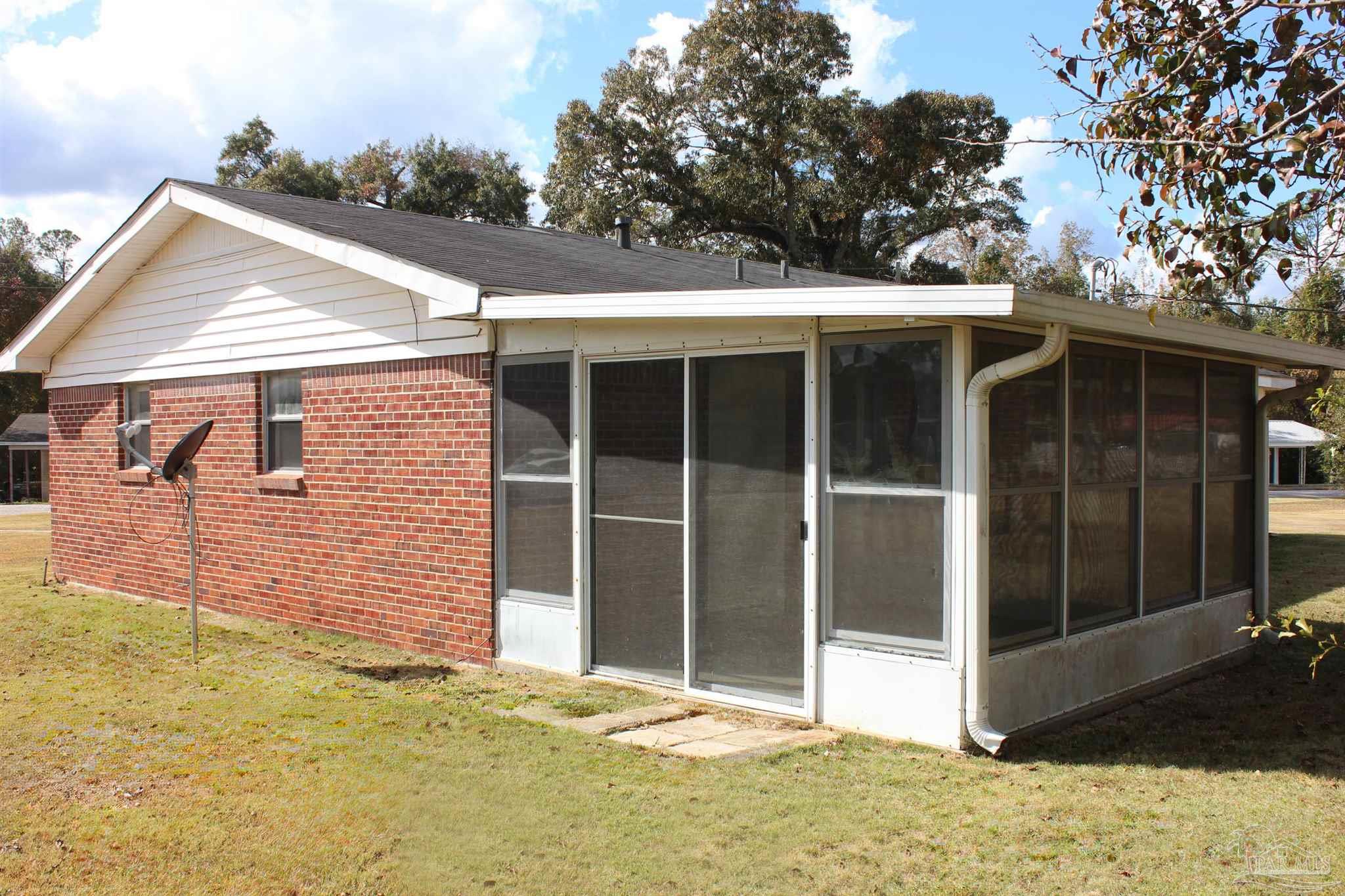 141 Holt Street Flomaton, AL 36441 - Photo 10 of 28 a view of a house with a backyard