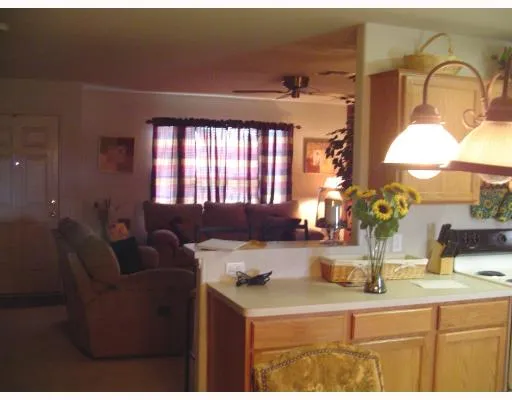 a kitchen with a refrigerator and a sink