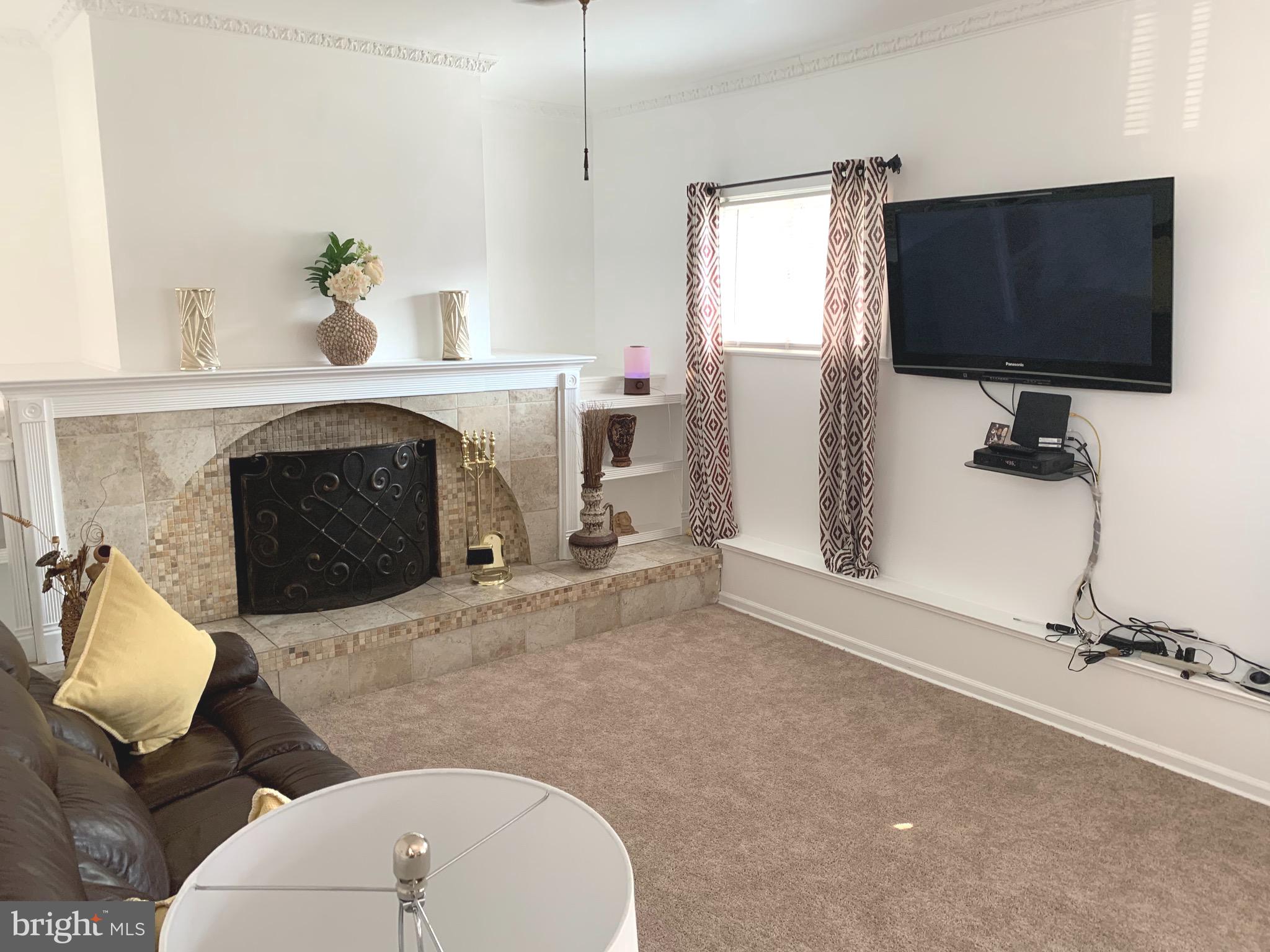 3817 Elmcroft Road Randallstown, MD 21133 - Photo 24 of 33 Main Level Family Room with Fireplace