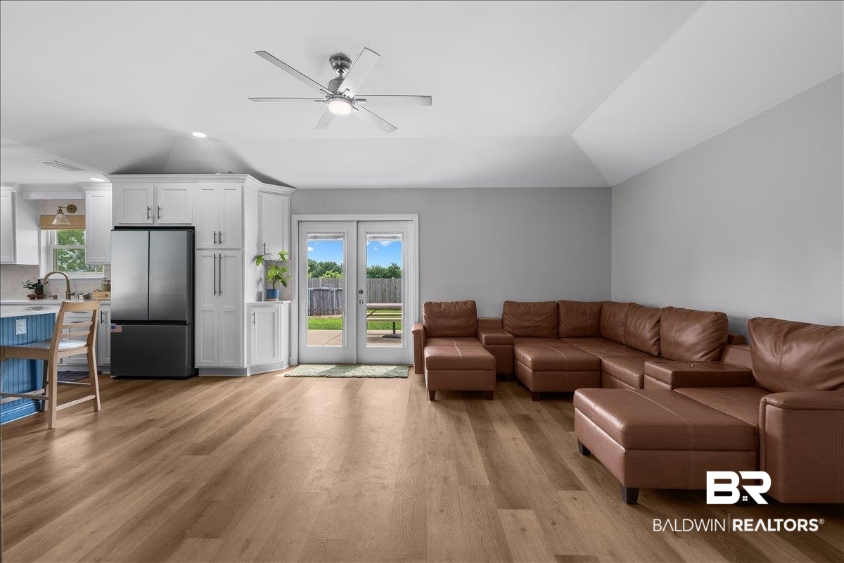 8952 Sherman Road Foley, AL 36535 - Photo 10 of 41 Open-concept living space featuring wood-finish flooring, a contemporary ceiling fan, and recessed lighting