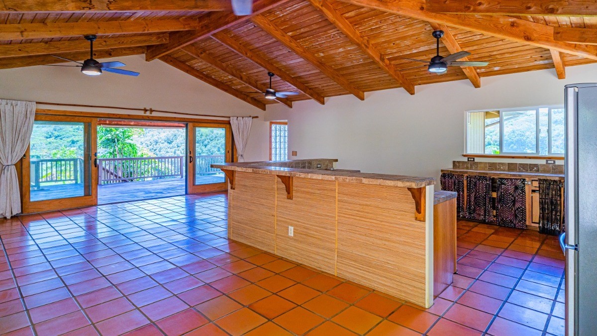 2435 Waipuna Road, Unit 12 Lihue, HI 96766 - Photo 15 of 27 a view of a porch with wooden floor and furniture