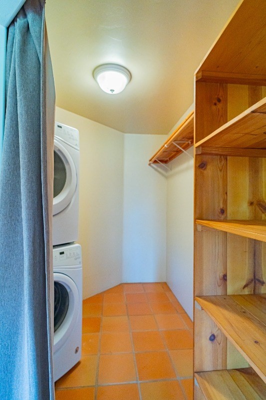 2435 Waipuna Road, Unit 12 Lihue, HI 96766 - Photo 17 of 27 a view of walk in closet with clothes and shoes