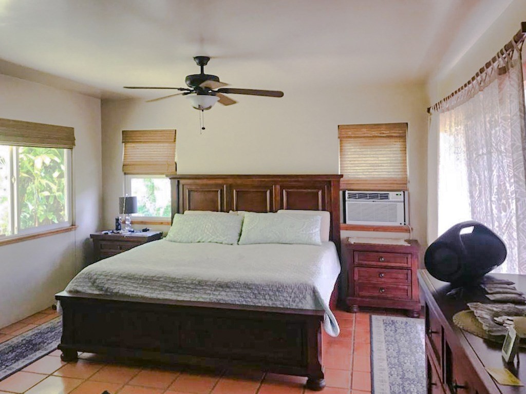2435 Waipuna Road, Unit 12 Lihue, HI 96766 - Photo 23 of 27 a bedroom with a bed and window