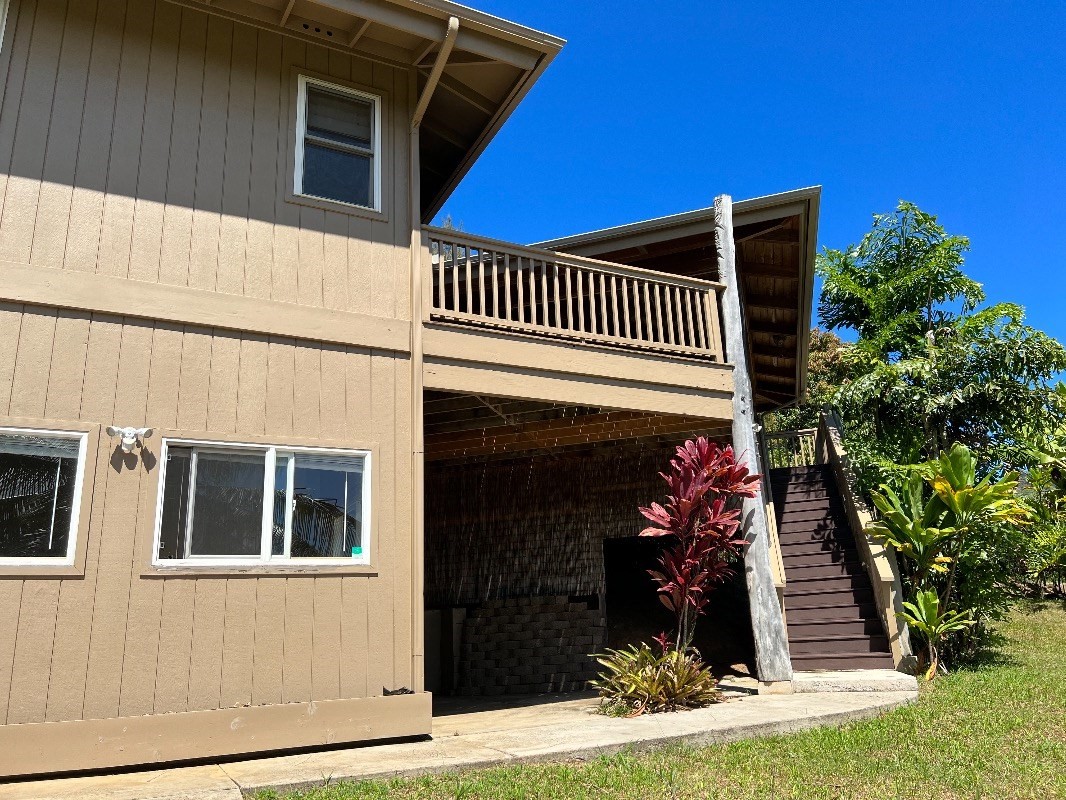 2435 Waipuna Road, Unit 12 Lihue, HI 96766 - Photo 25 of 27 a front view of a house with entryway