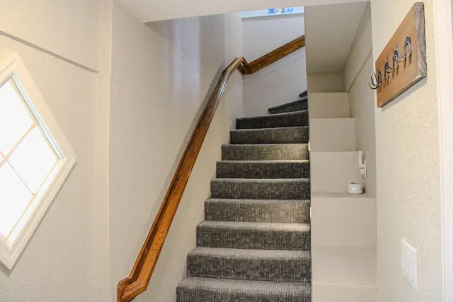 a view of an empty room with garden and plants