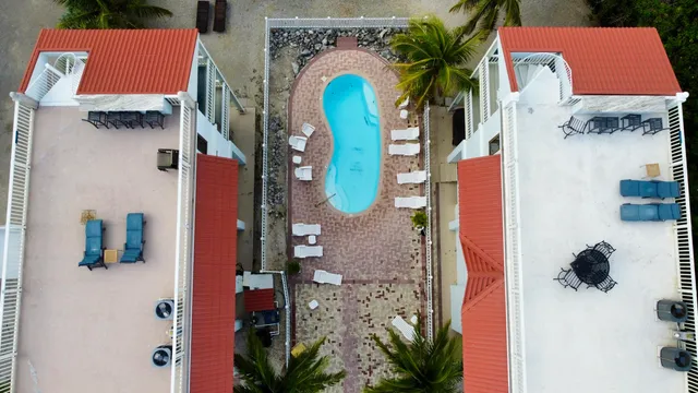 an aerial view of multiple houses with outdoor space