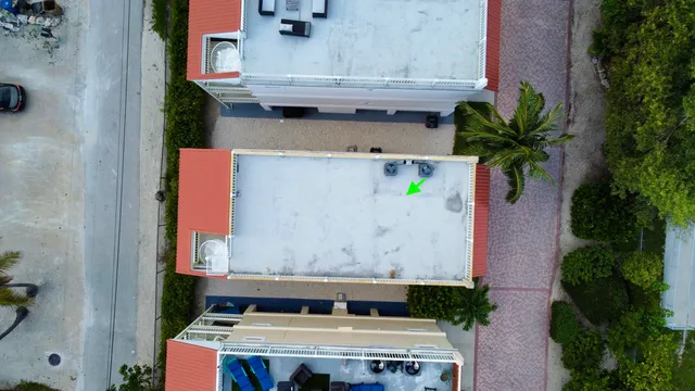 a front view of multi story residential apartment building with yard