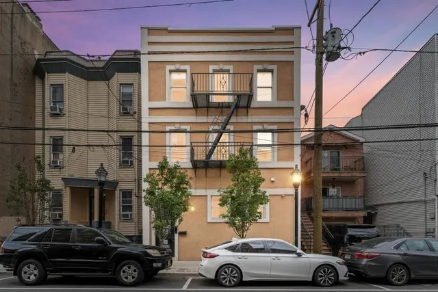 a view of a car parked in front of a house