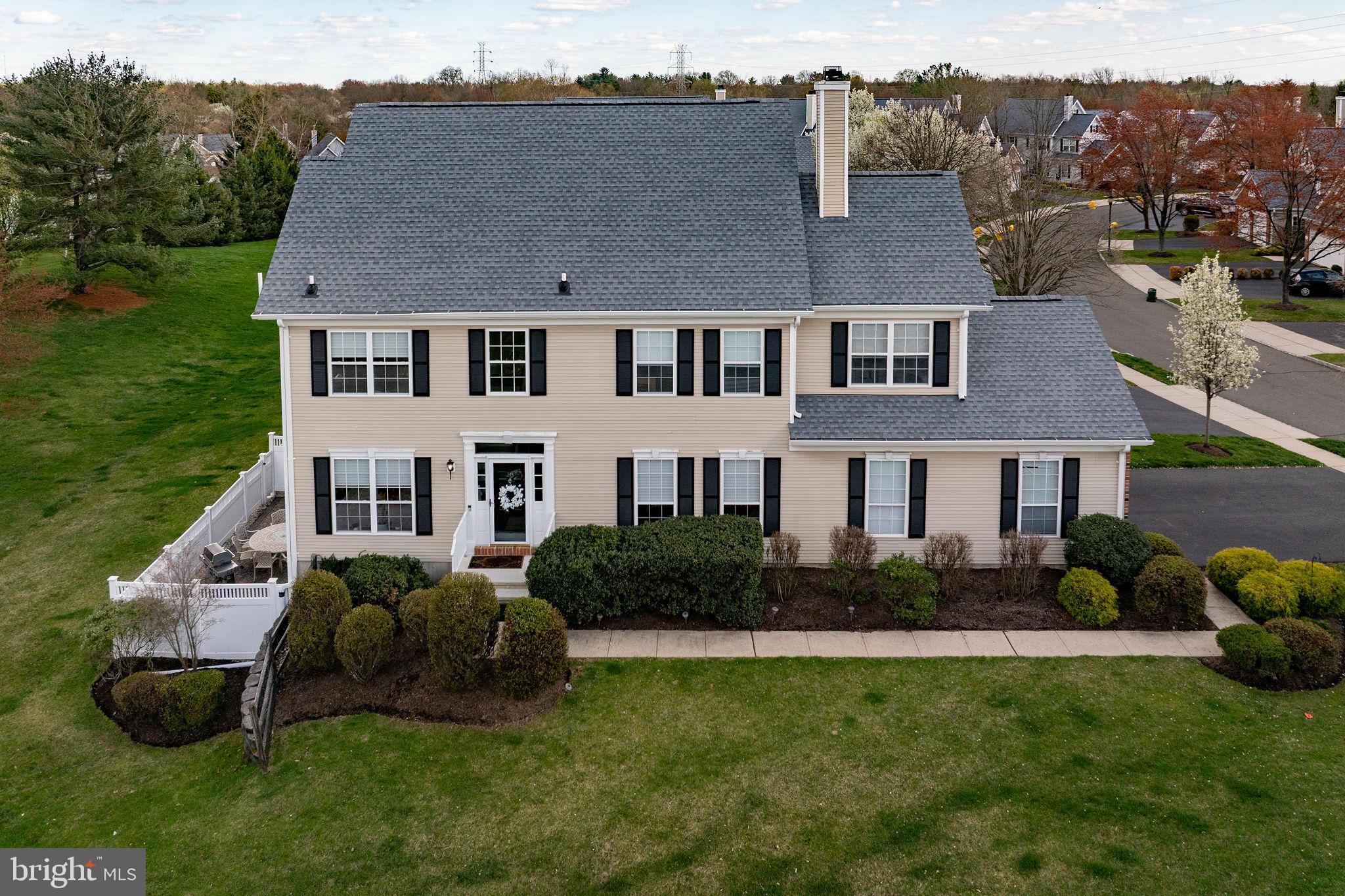 243 Colt Street Pennington, NJ 08534 - Photo 1 of 46 a aerial view of a house next to a big yard and potted plants