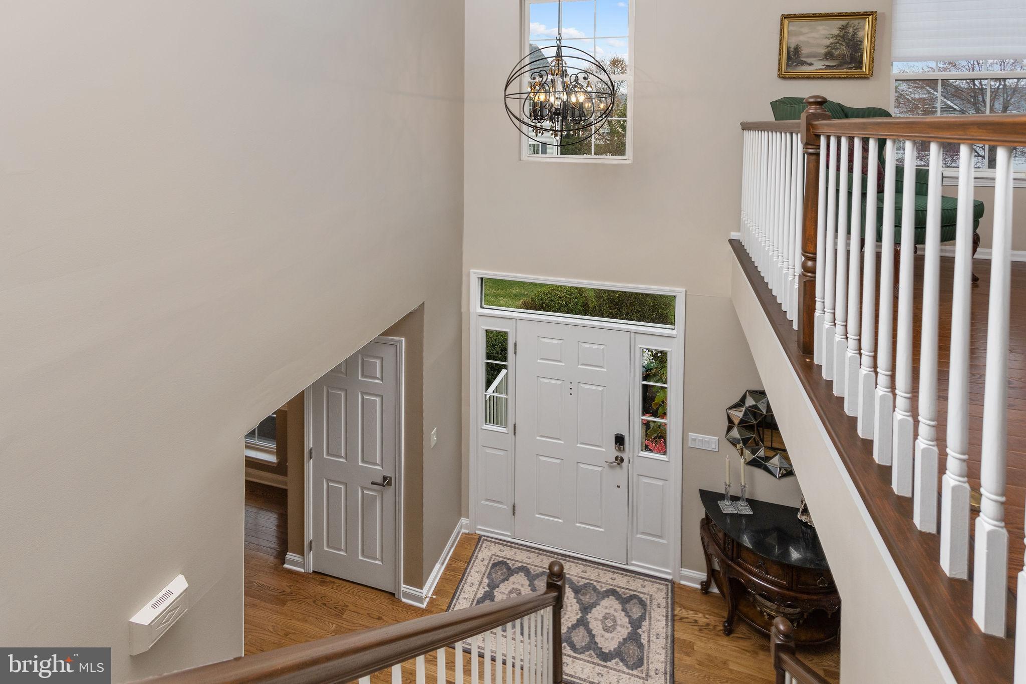 243 Colt Street Pennington, NJ 08534 - Photo 25 of 46 a view of an entryway with wooden floor