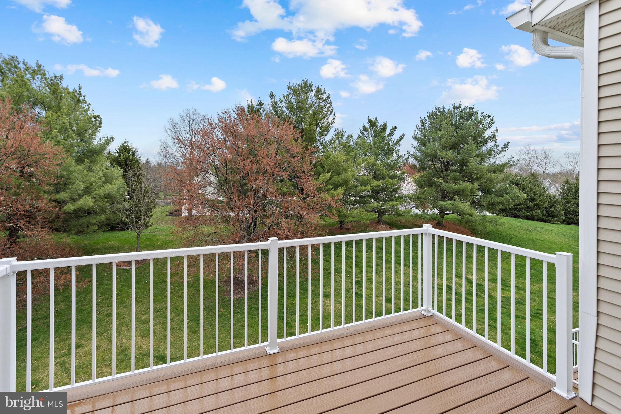 243 Colt Street Pennington, NJ 08534 - Photo 31 of 46 a balcony with wooden floor and fence