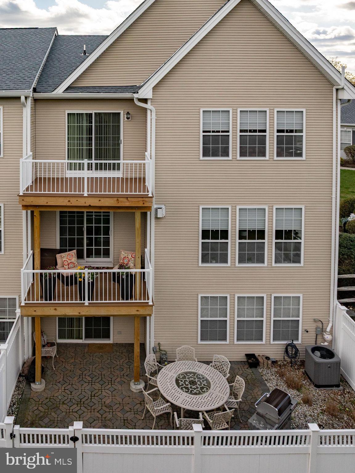 243 Colt Street Pennington, NJ 08534 - Photo 42 of 46 a front view of a house with garden