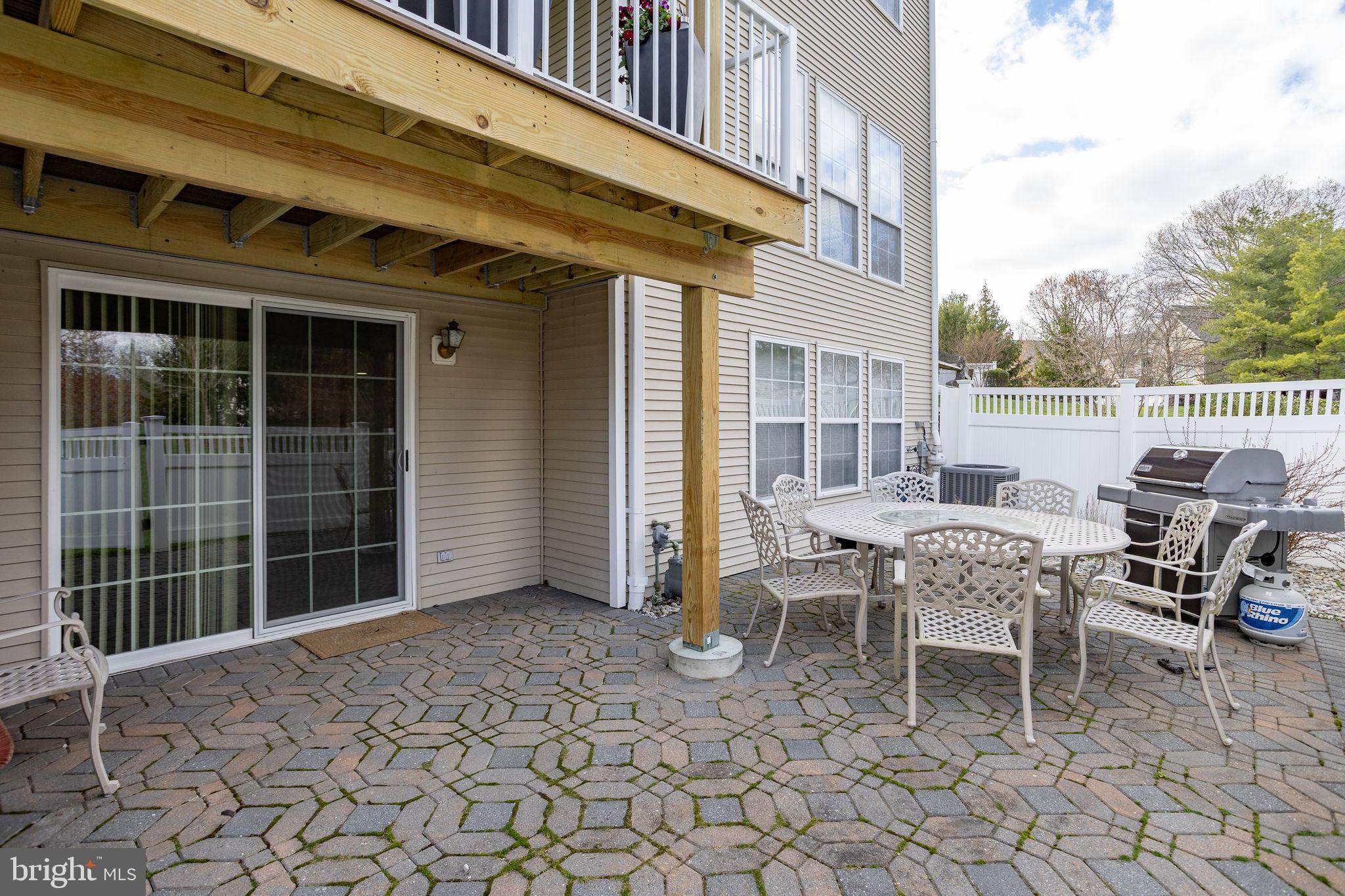 243 Colt Street Pennington, NJ 08534 - Photo 44 of 46 a balcony with furniture and a potted plant