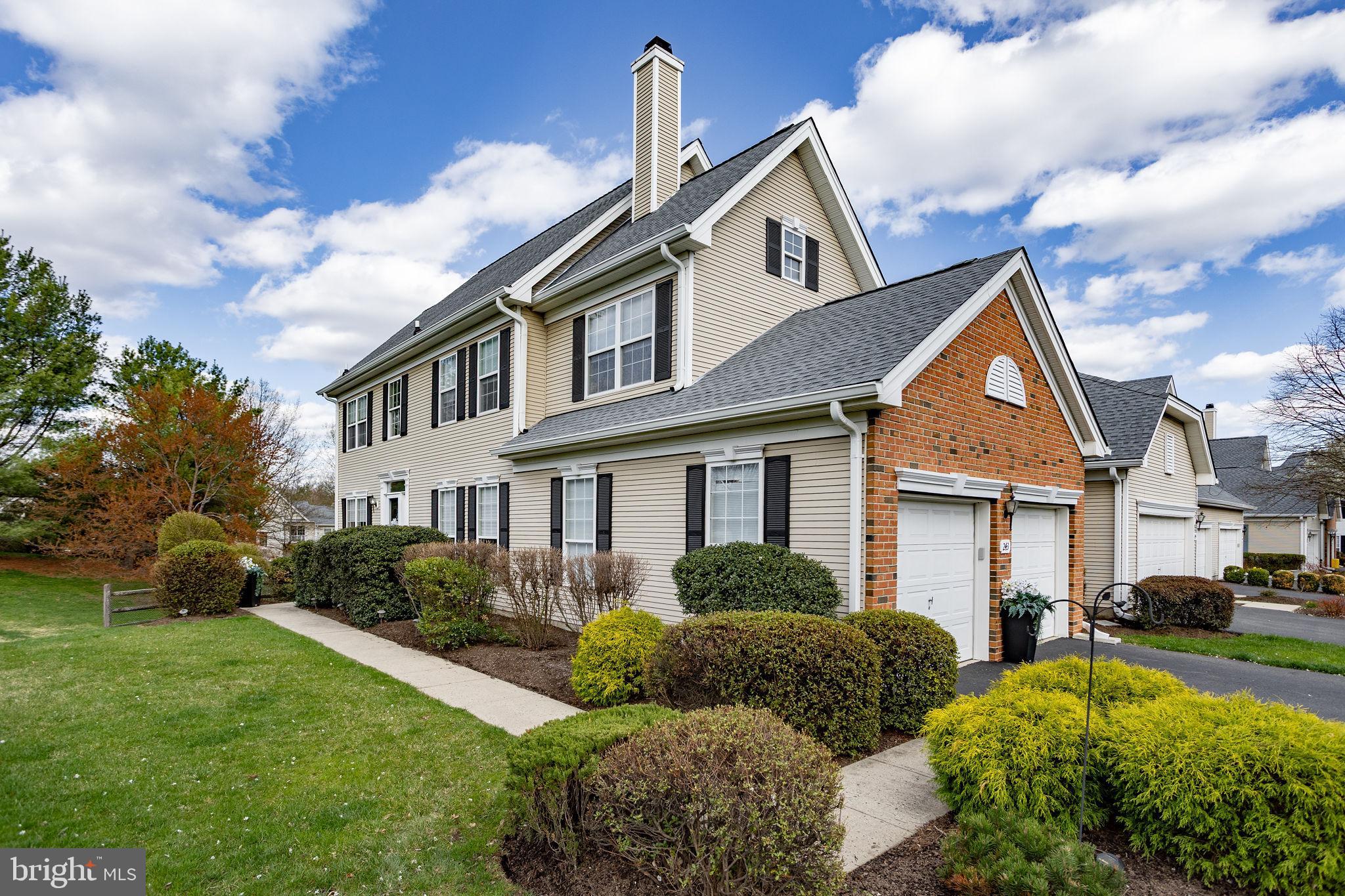 243 Colt Street Pennington, NJ 08534 - Photo 5 of 46 a front view of a house with a yard