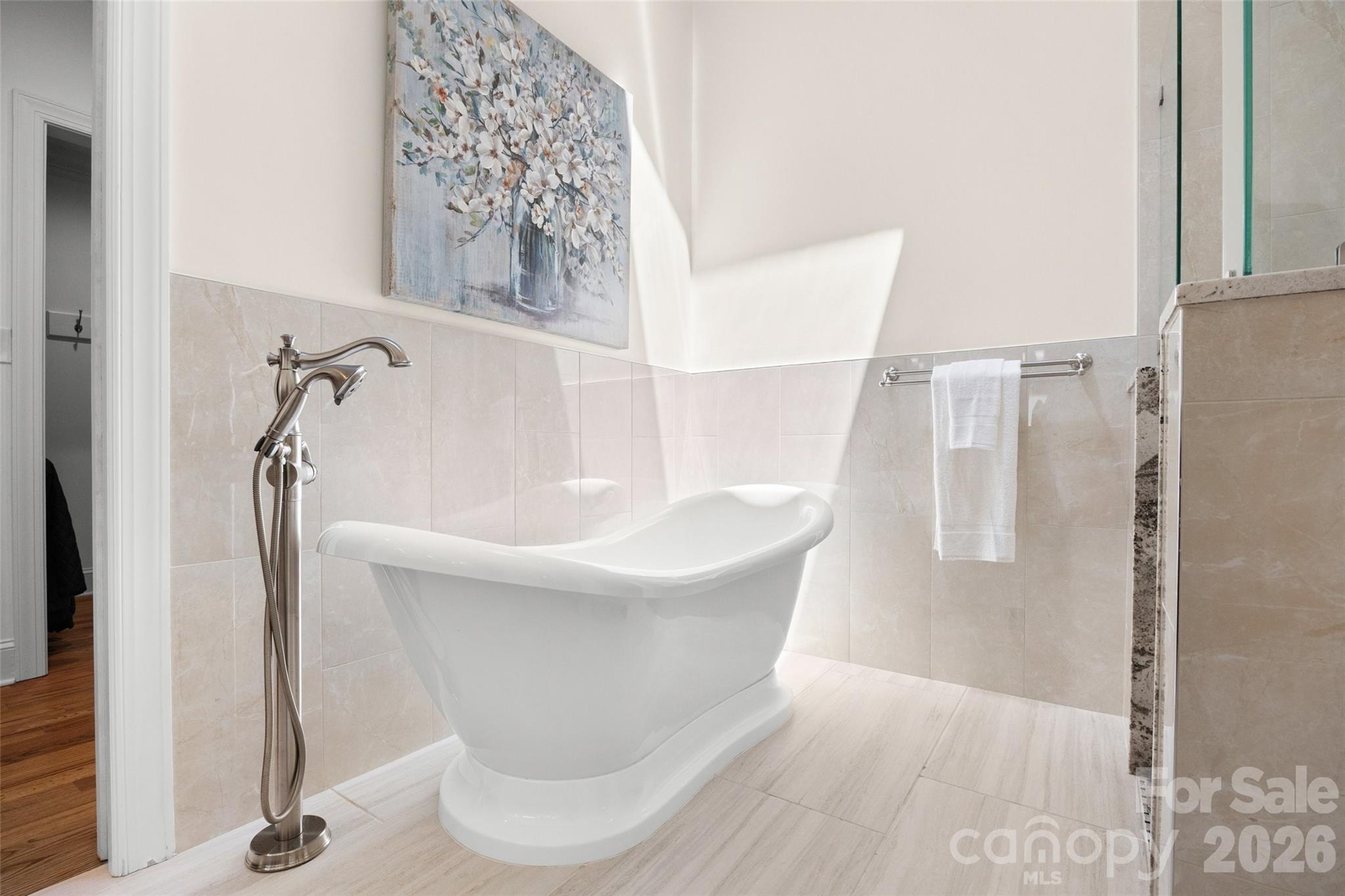 636 Landsdowne Court Fort Mill, SC 29708 - Photo 22 of 48 a bathroom with a bathtub and a shower