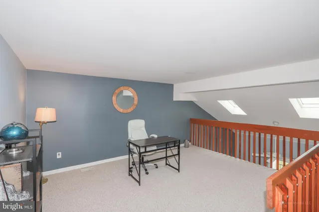 a bathroom with a sink a toilet and shower curtain