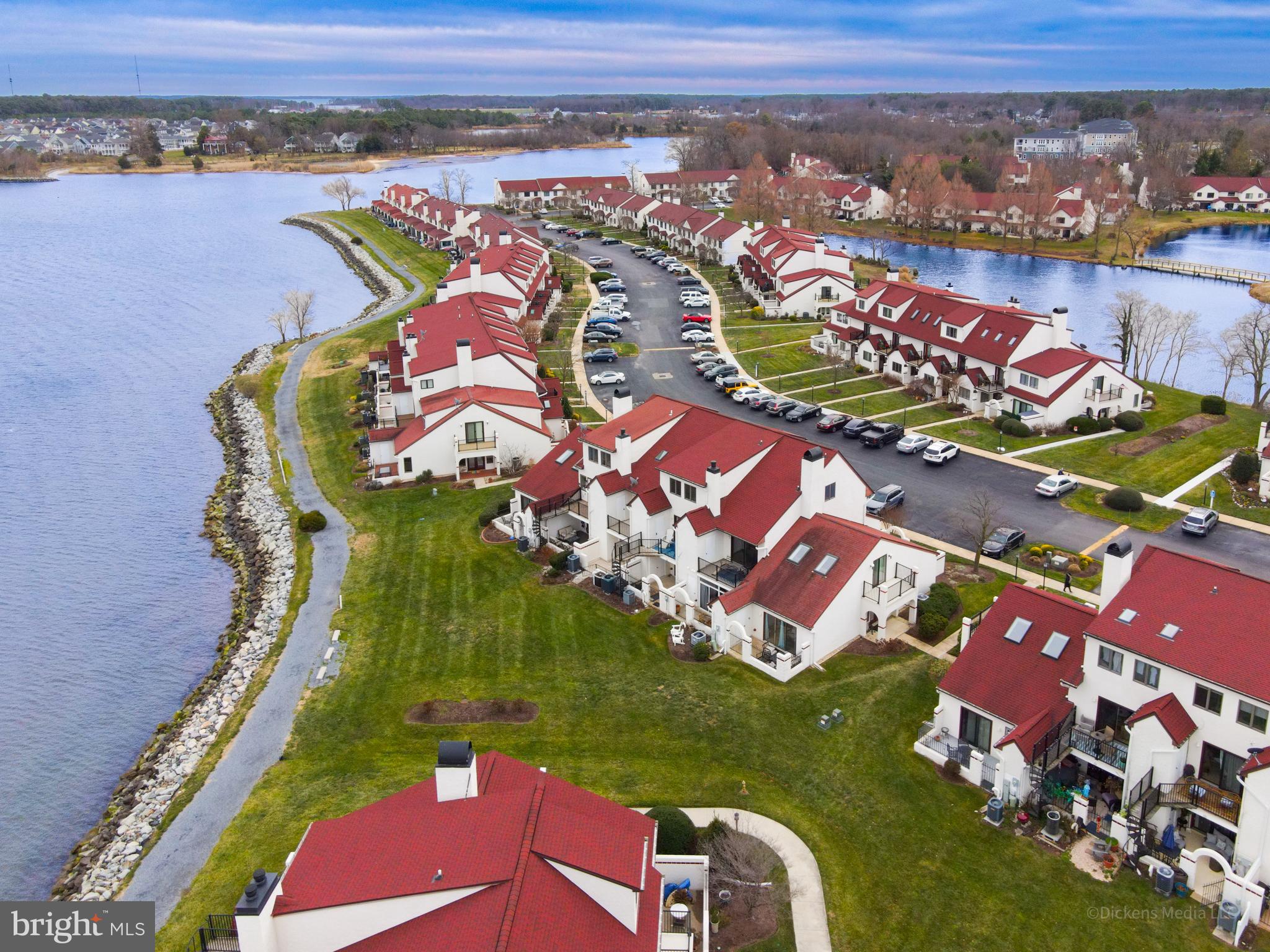15 Queen Anne Way, Unit E Chester, MD 21619 - Photo 15 of 18 an aerial view of a house with a garden and pool