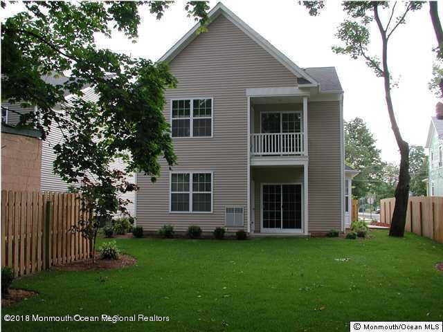 222 Bridge Avenue Red Bank, NJ 07701 - Photo 9 of 11 front view of a house with a garden