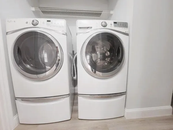 a utility room with dryer and washer