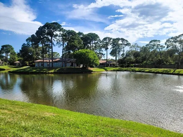 a view of a lake with a building in the background