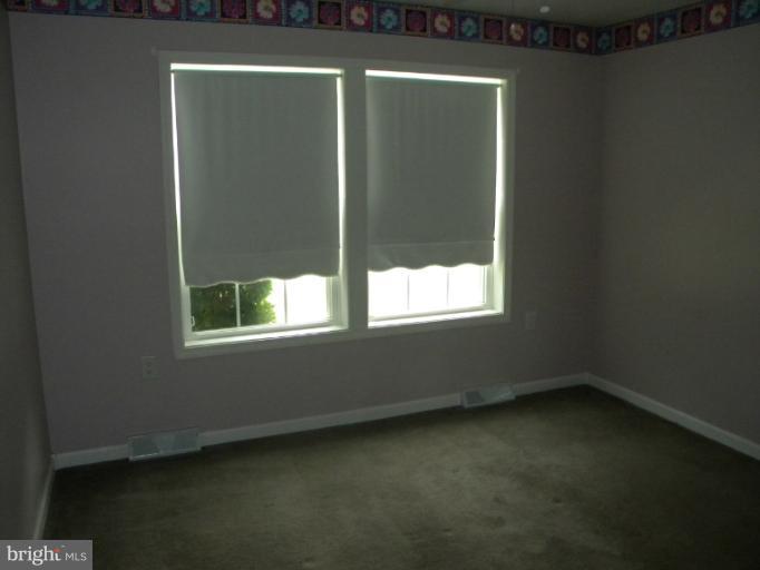 6125 Timber Ridge Road Berkeley Springs, WV 25411 - Photo 14 of 24 a view of an empty room with a window