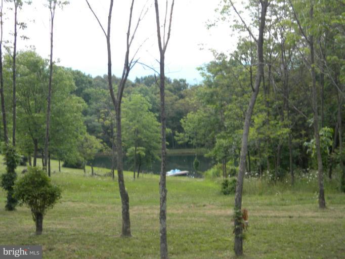 6125 Timber Ridge Road Berkeley Springs, WV 25411 - Photo 18 of 24 a view of lake with green space