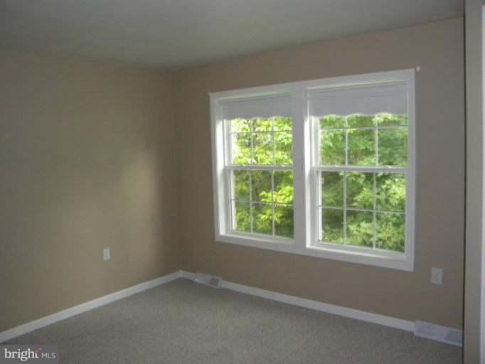 6125 Timber Ridge Road Berkeley Springs, WV 25411 - Photo 8 of 24 an empty room with a window
