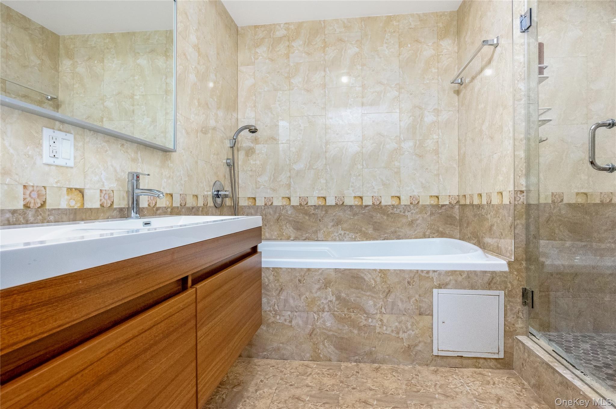 63-36 99th Street, Unit 4F Queens, NY 11374 - Photo 14 of 21 a bathroom with a bathtub and a sink