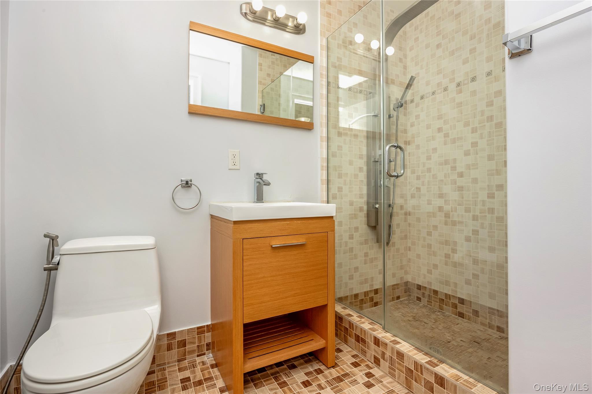 63-36 99th Street, Unit 4F Queens, NY 11374 - Photo 16 of 21 a bathroom with a granite countertop sink toilet and shower