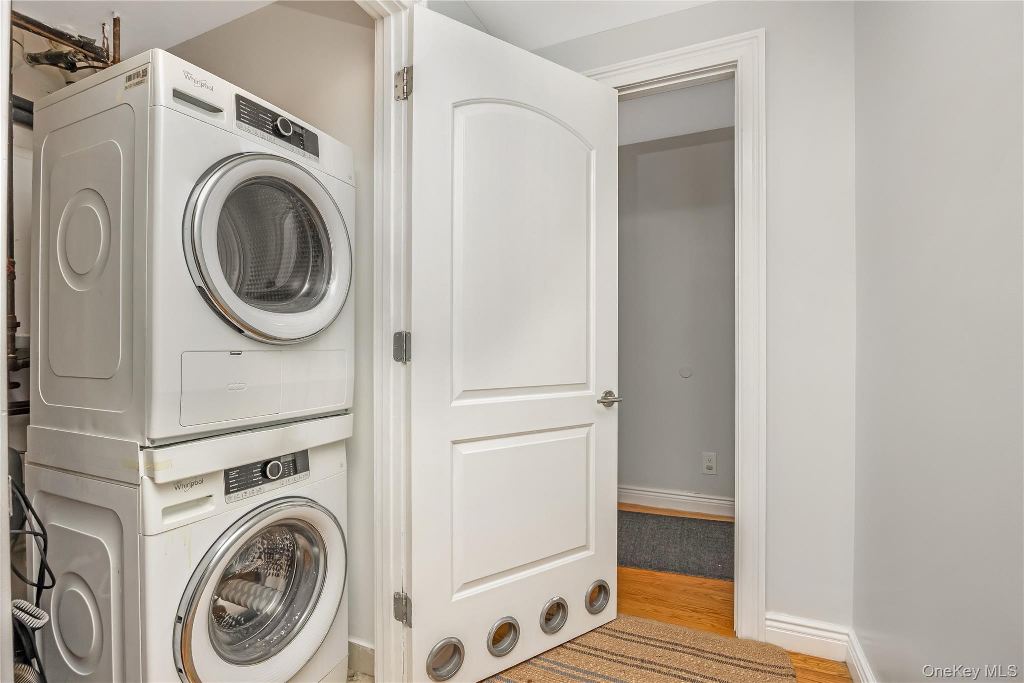 63-36 99th Street, Unit 4F Queens, NY 11374 - Photo 20 of 21 a view of a hallway with washer and dryer