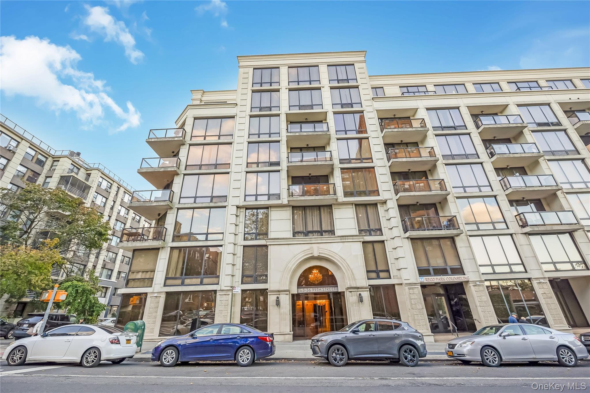 63-36 99th Street, Unit 4F Queens, NY 11374 - Photo 2 of 21 a car parked in front of a building
