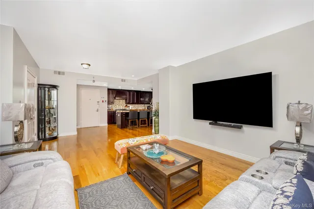 a bedroom with furniture and a flat screen tv