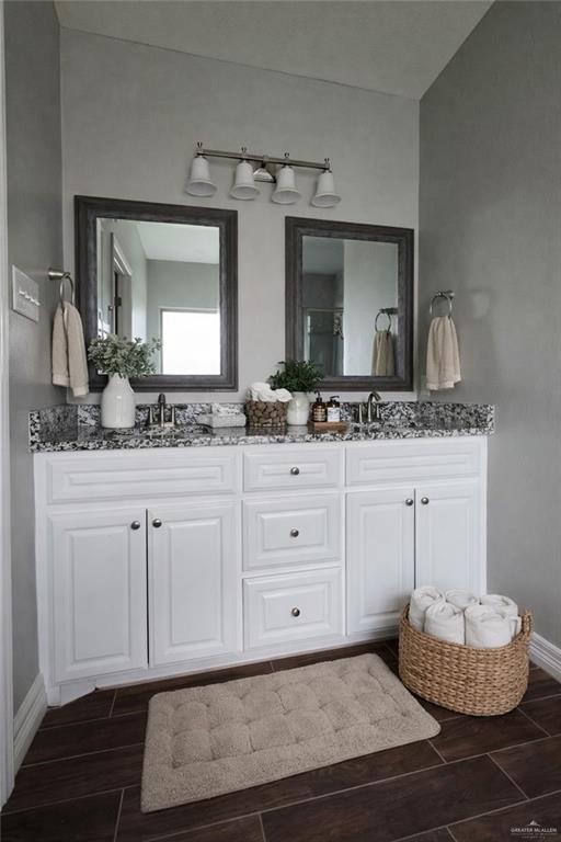 4894 County Road, Unit 2015 Odem, TX 78370 - Photo 12 of 20 Bathroom featuring double vanity and wood finish floors