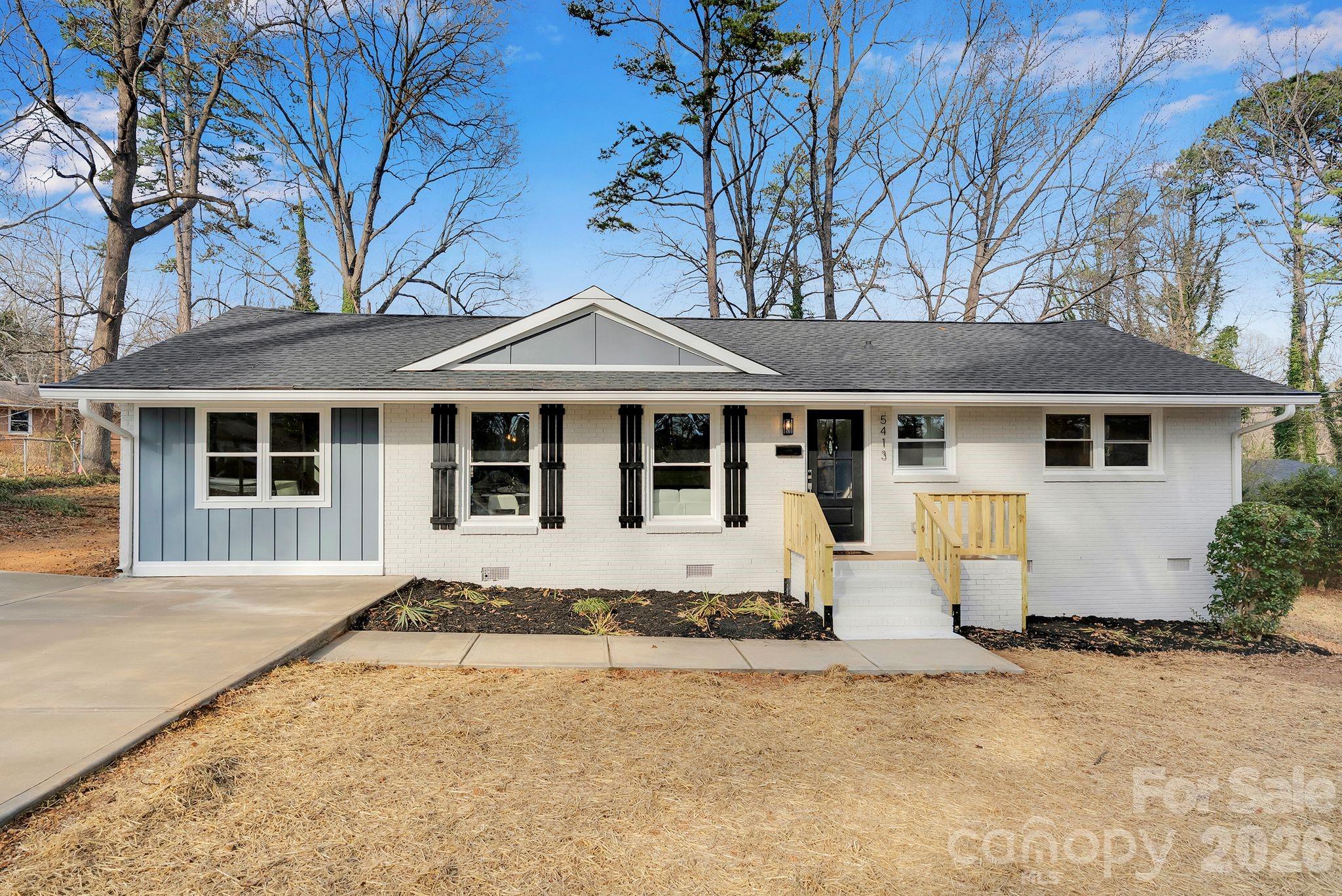 front view of a house with a yard