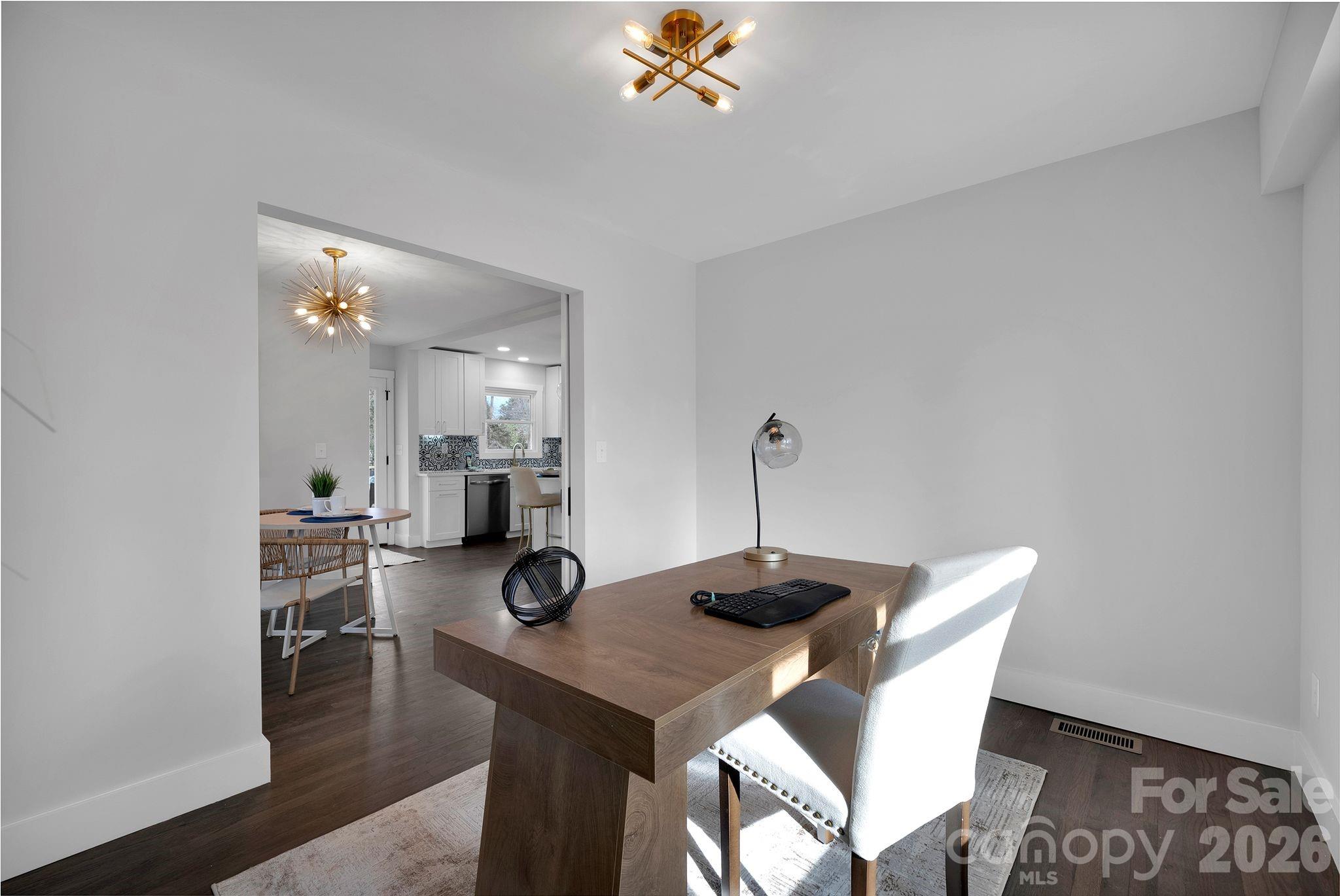 5413 Ruth Drive Charlotte, NC 28215 - Photo 12 of 29 a view of a dining room with furniture and wooden floor
