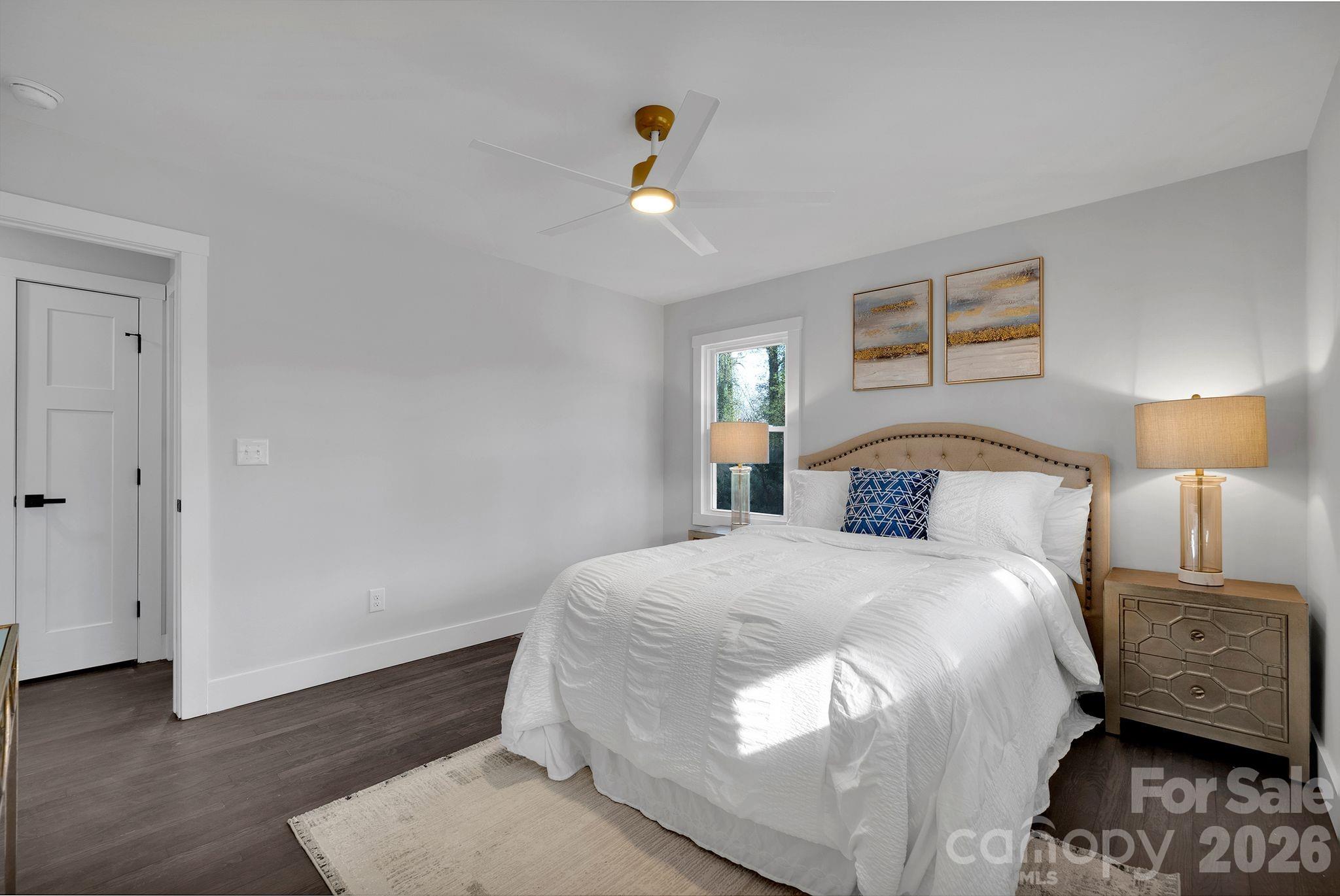 5413 Ruth Drive Charlotte, NC 28215 - Photo 16 of 29 a bedroom with a bed and wooden floor