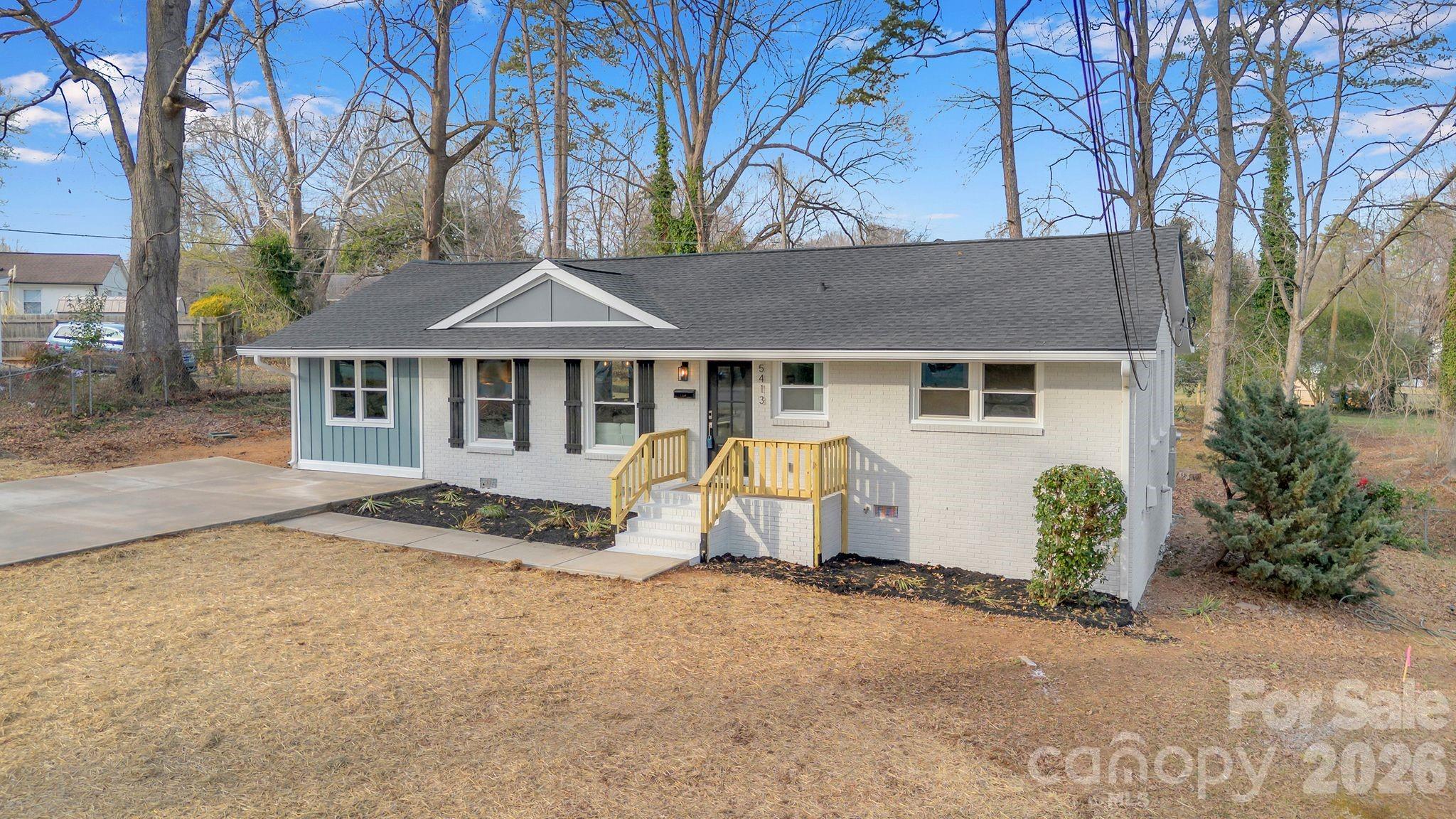5413 Ruth Drive Charlotte, NC 28215 - Photo 2 of 29 a view of a house with backyard and chairs