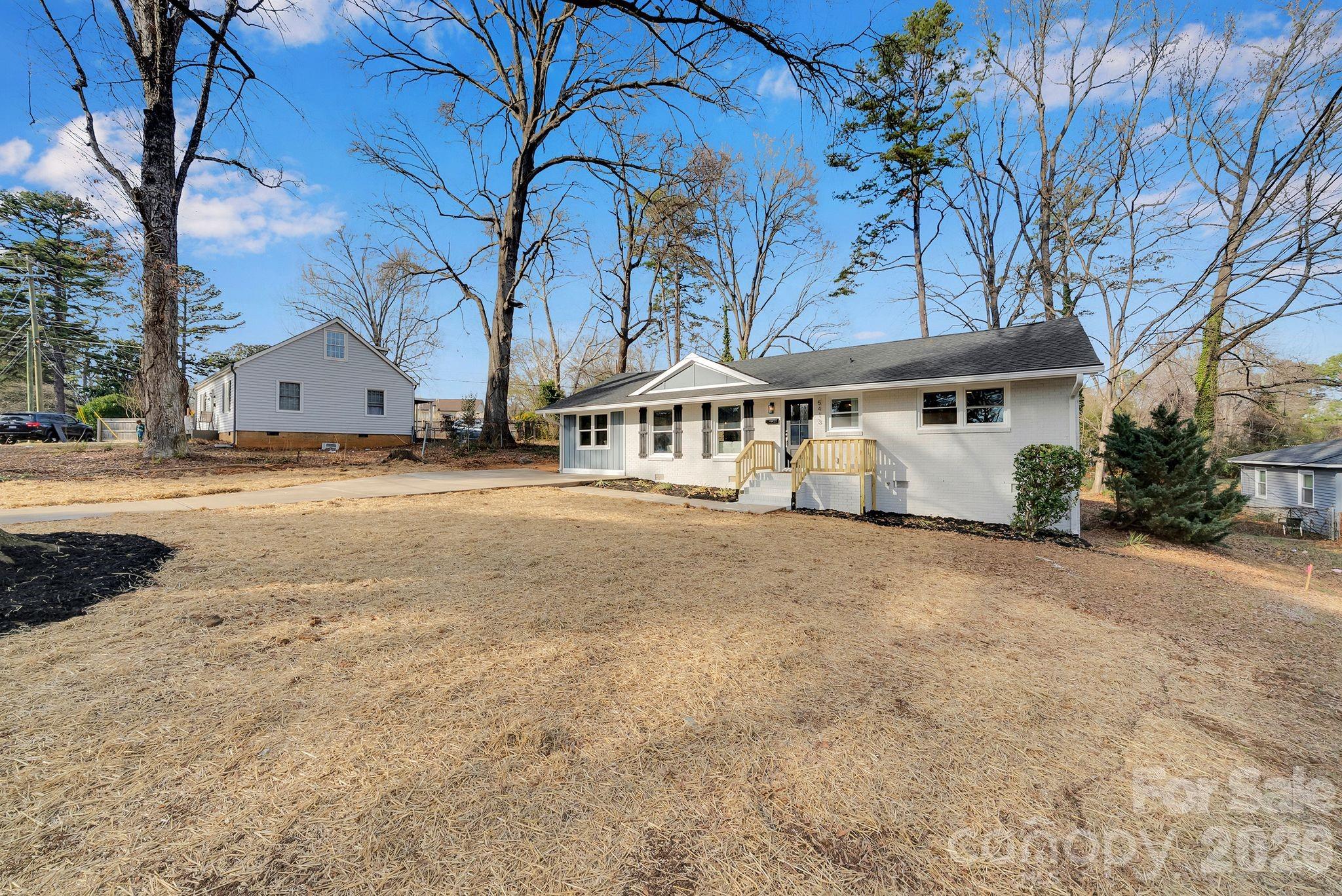 5413 Ruth Drive Charlotte, NC 28215 - Photo 3 of 29 a view of multiple houses with a yard