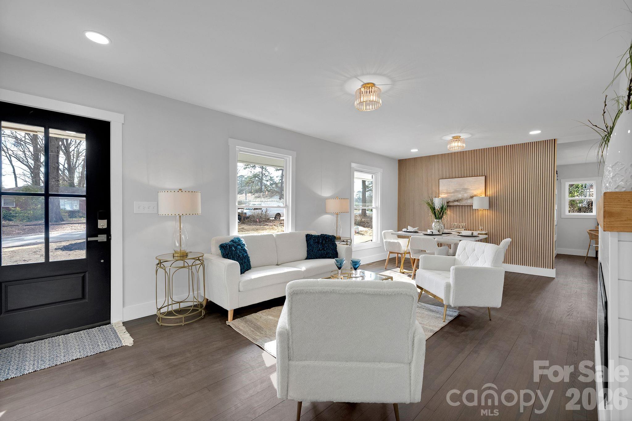 5413 Ruth Drive Charlotte, NC 28215 - Photo 4 of 29 a living room with furniture a large window and wooden floor