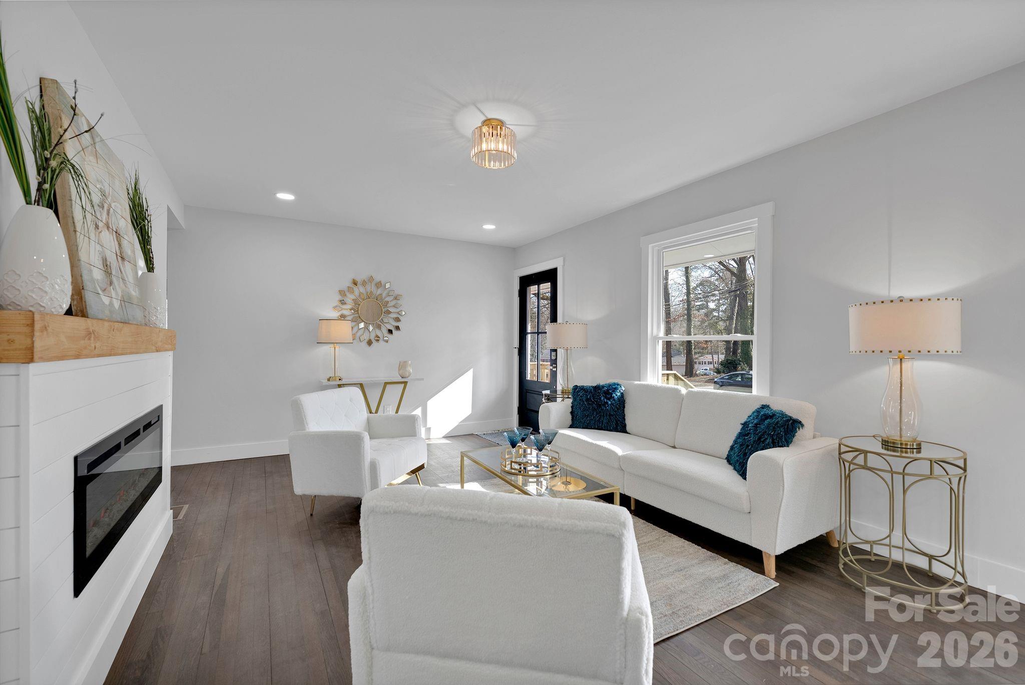 5413 Ruth Drive Charlotte, NC 28215 - Photo 6 of 29 a living room with furniture and a fireplace