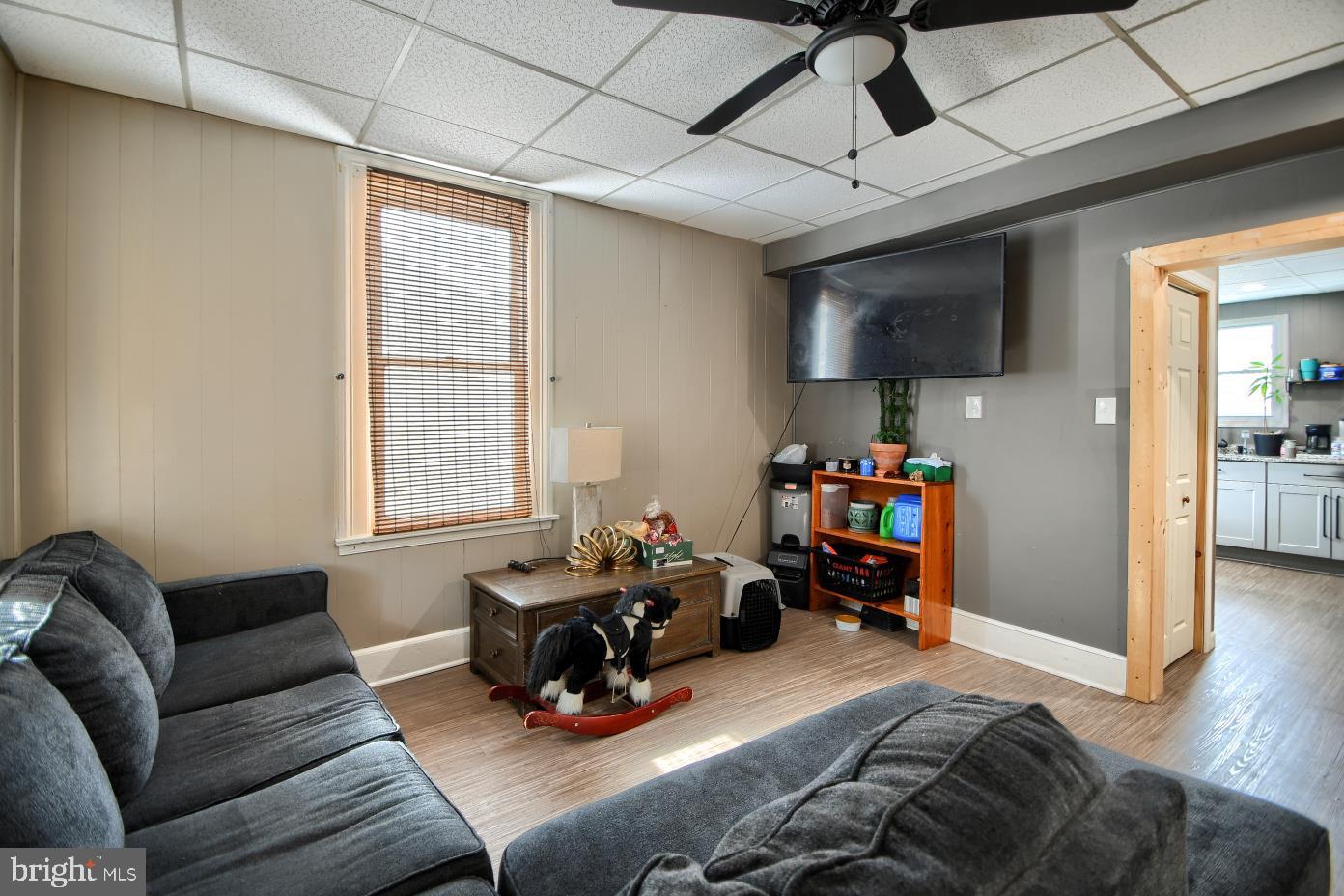 1251 Kimberton Road Chester Springs, PA 19425 - Photo 12 of 31 a living room with furniture a flat screen tv and a window