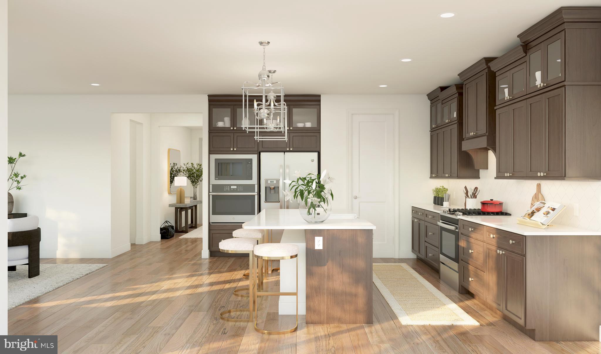 843 Merlin Drive Middletown, DE 19709 - Photo 7 of 16 a kitchen with stainless steel appliances kitchen island granite countertop a sink and a refrigerator